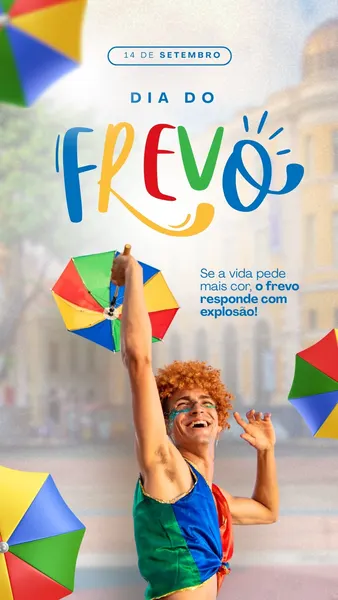 Um homem sorridente com cabelo cacheado ruivo e maquiagem colorida no rosto, vestindo uma roupa vibrante, segura uma sombrinha colorida típica do frevo. Ao fundo, prédios e outras sombrinhas coloridas. O texto 'Dia do Frevo' em letras grandes e coloridas domina a parte superior.