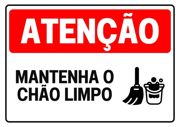 Placa de atenção com fundo branco, faixa vermelha superior com a palavra "ATENÇÃO" em branco. Abaixo, em preto, a frase "MANTENHA O CHÃO LIMPO" e um ícone de vassoura e balde com água e espuma.