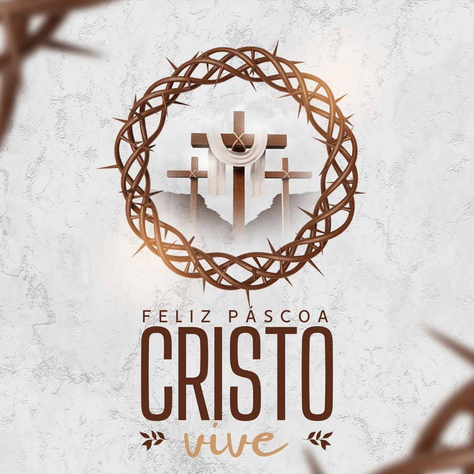 Um post de Instagram com a frase "Feliz Páscoa Cristo Vive" em destaque. Ao centro, uma coroa de espinhos envolve três cruzes com um pano branco, simbolizando a ressurreição de Cristo.