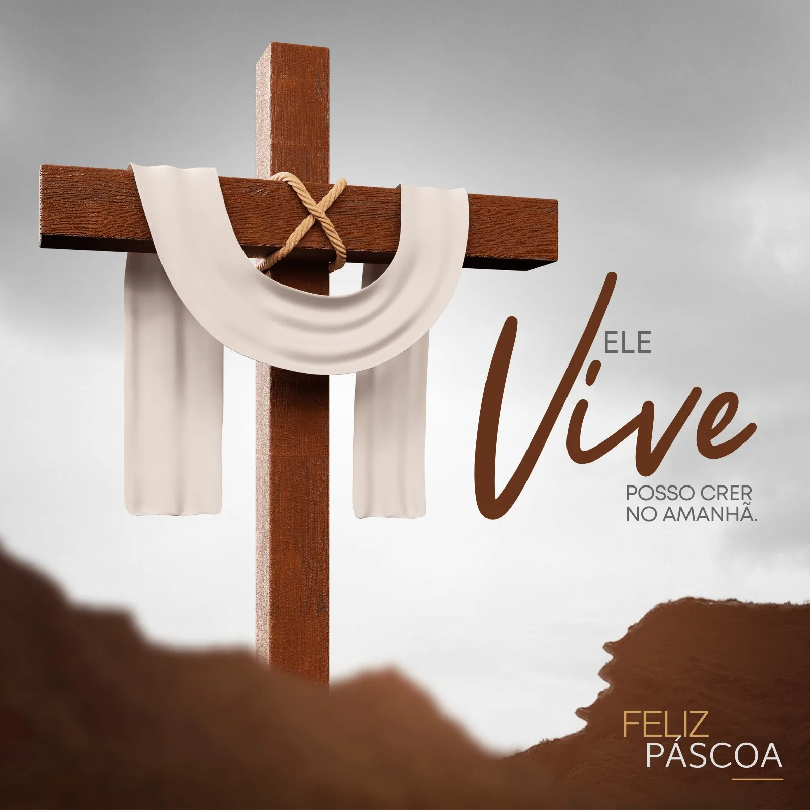 Post para feed do Instagram com uma cruz de madeira marrom com um pano branco amarrado, simbolizando a ressurreição. Ao lado, a frase 'Ele Vive' e 'Posso crer no amanhã'. No canto inferior direito, 'Feliz Páscoa'.