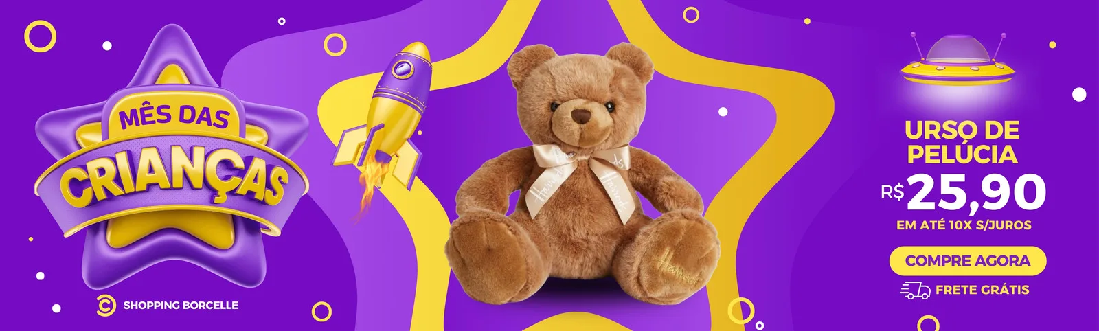Banner horizontal roxo e amarelo com o tema Mês das Crianças. Apresenta um urso de pelúcia, um foguete e um OVNI, com destaque para a oferta "Urso de Pelúcia R$ 25,90 em até 10x sem juros" e botão "Compre Agora".