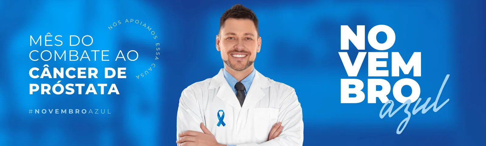 Banner horizontal azul com a frase 'Mês do Combate ao Câncer de Próstata' e '#NovembroAzul'. Um médico sorri com os braços cruzados, usando um jaleco branco com um laço azul, promovendo a campanha.